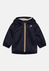 Giacca blu navy con cappuccio, caratterizzata da una cerniera frontale gialla e blu e una morbida fodera crema. Maniche lunghe con polsini elasticizzati.