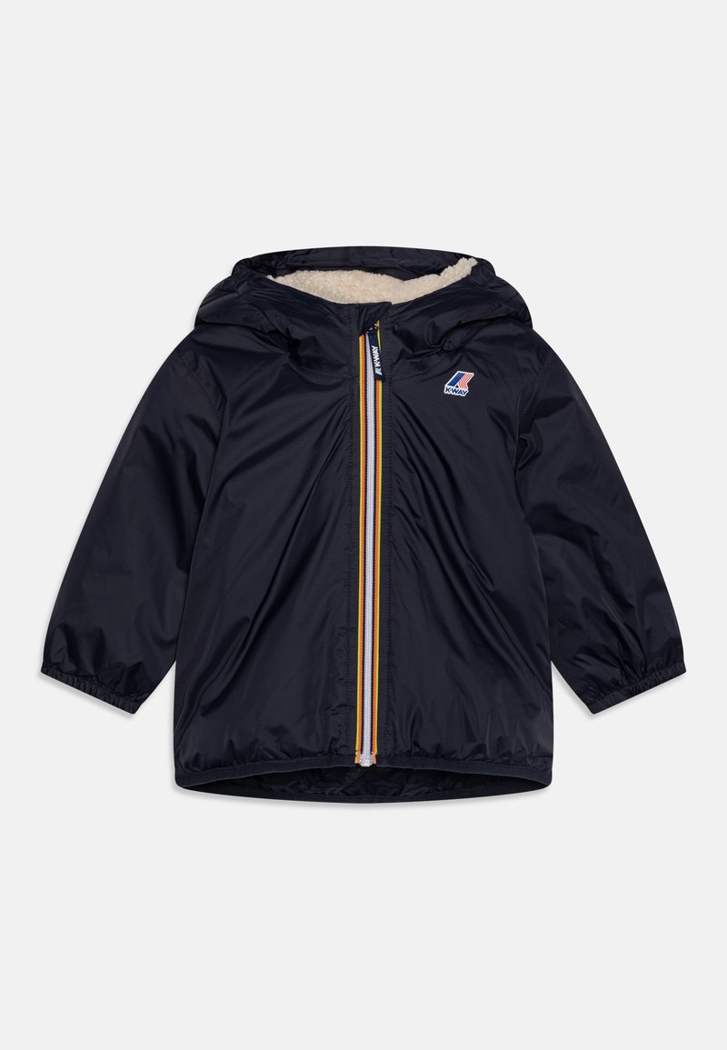 Giacca blu navy con cappuccio, caratterizzata da una cerniera frontale gialla e blu e una morbida fodera crema. Maniche lunghe con polsini elasticizzati.