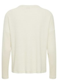 Maglia a maniche lunghe in crema chiaro, con texture a coste, ampia scollatura rotonda e vestibilità rilassata con orlo rifinito sul fondo.