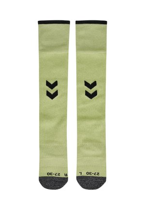 Paar hellgrüne knielange Socken mit schwarzen Zehenkappen, schwarzen doppelten Chevron-Mustern in der Mitte und schwarzen oberen Rändern.