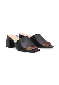 Black open-toe mules made from smooth faux leather, featuring a square toe and a chunky heel with a satin finish.