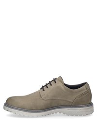 Scarpa casual beige con una texture liscia, punta tonda e lacci neri. Presenta una suola leggermente sollevata e dettagli di cucitura discreti.