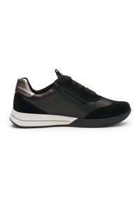 Black low-top sneaker with white sole, side zipper, lace-up front, and metallic accent on heel.