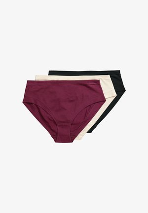 Tres bragas de algodón para mujer en burdeos, beige y negro, apiladas con el par burdeos encima sobre un fondo blanco.