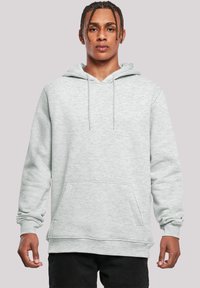 Light gray hooded sweatshirt with a front pocket, drawstring hood, and ribbed cuffs and hem. Soft texture, casual design.