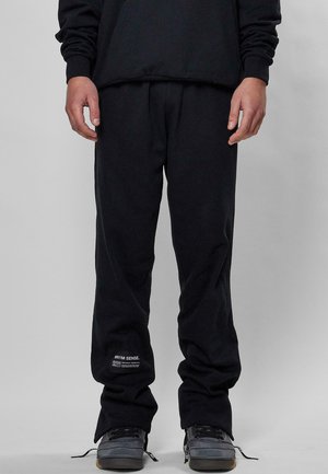 HERREN SENSE  - Tracksuit bottoms - black