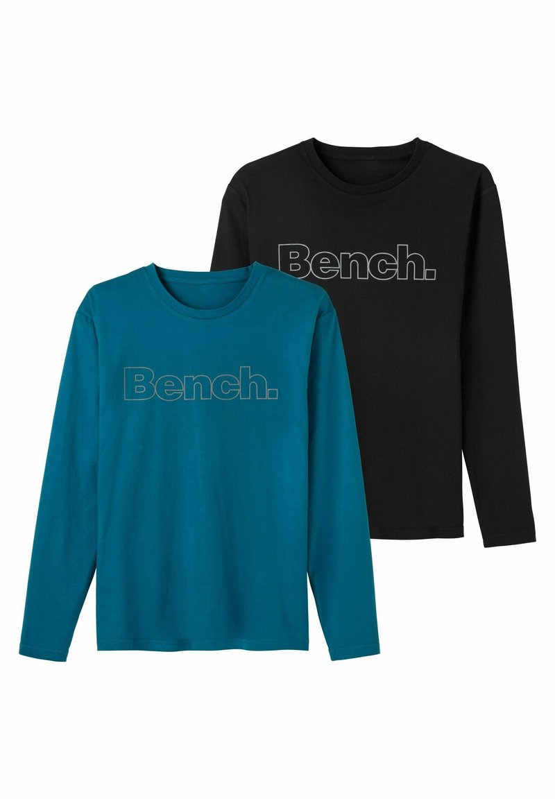 Two long-sleeve t-shirts: one in teal with a gray “Bench.” logo, and one in black with a gray “Bench.” logo. Cotton material, crew neck.