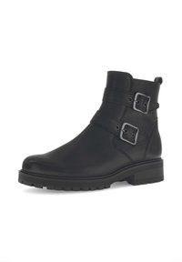 Stivaletto in pelle nera con due fibbie laterali, punta arrotondata, parte superiore testurizzata e suola robusta per una migliore aderenza.