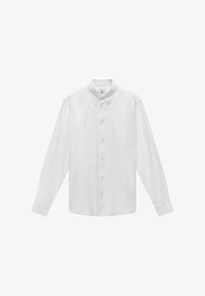 Vit långärmad skjorta med knapplist i slät tyg. Har en spetsig krage, knäppt front och rak passform.