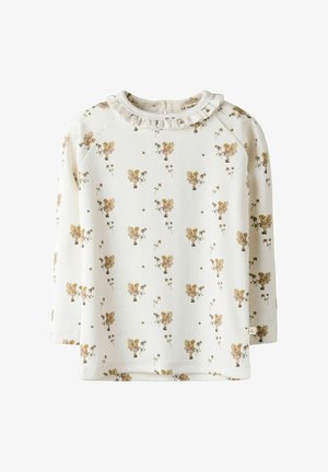 Svijetlosmeđa majica dugih rukava s volanima na izrezima i cvjetnim uzorkom sa zlatnim akcentima i malim ilustracijama. Mekana tkanina.