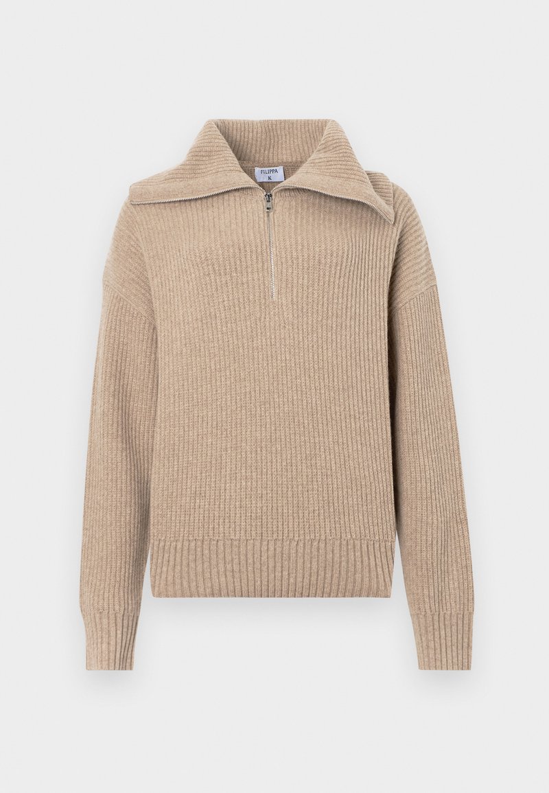 Beige stickad tröja med halvdragkedja, ribbad textur och långa ärmar. Har en cropped passform och ett mjukt, varmt material.