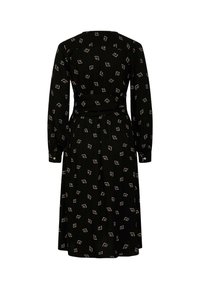 Robe noire à manches longues, taille cintrée et jupe fluide. Présente un motif géométrique répété en blanc.