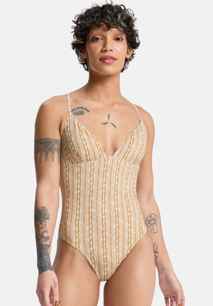Jednoczęściowy strój kąpielowy z geometrycznym wzorem w brązowym i kremowym kolorze, z cienkimi regulowanymi ramiączkami i głębokim dekoltem w kształcie litery V.