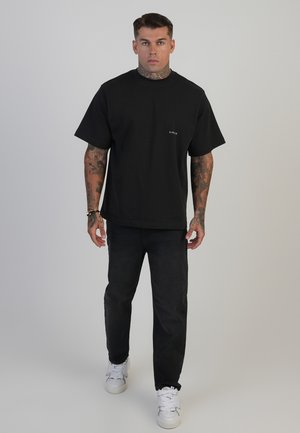 Vaqueros tapered - washed black