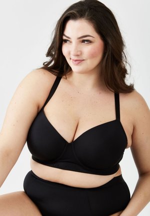 Zwarte onderwire bh met verstelbare schouderbanden, gladde stof en een diepe decolleté. Vergezeld van een bijpassende high-waist slip.