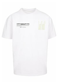 White cotton t-shirt with short sleeves. Front features black text "youth is wasted on the young" and light green "Lost Youth" graphic.