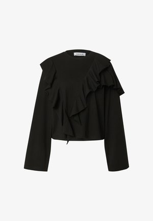 Zwarte lange mouwen top met opvallende ruches aan de linkerkant en een cropped ontwerp. Zachte stof met een relaxte pasvorm.
