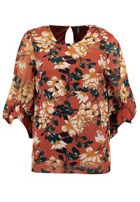 Blusa color ruggine con stampa floreale nei toni della crema e del verde. Presenta un collo a chiave e maniche corte e gonfiate. Tessuto dal tocco liscio.