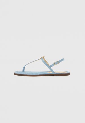 Blue denim flat sandal with a T-strap design, adjustable ankle strap, and a brown sole. Features a simple buckle accent.