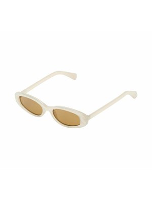 Oval-shaped sunglasses with translucent cream frames and brown tinted lenses, shown at a slight angle on a white background.