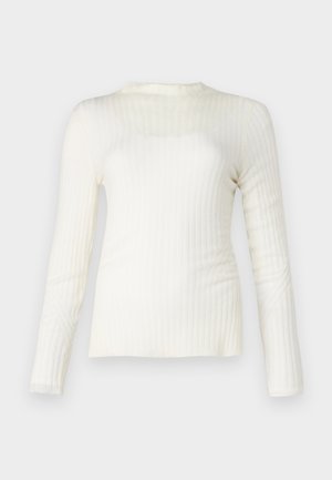 Hvid langærmet ribbet top, let tekstur, rund halsudskæring, tætsiddende pasform, subtil stræk, rene linjer og en glat finish.