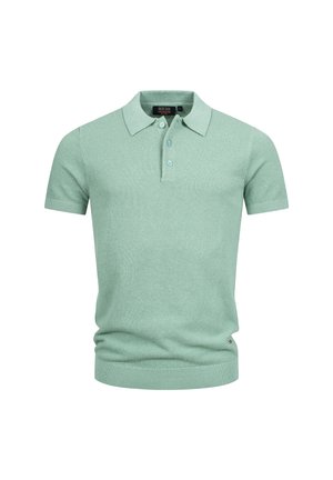 Ljusgrön kortärmad stickad polo med tre knappar samt ribbade muddar och nederkant, visad på en vit bakgrund.