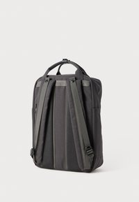 Black fabric backpack with mesh back, padded straps, and side pocket. Lightweight design with a handle and adjustable strap length.