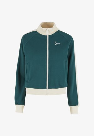 Zielononiebieska kurtka zapinana na zamek z wysokim kołnierzem, kremowymi akcentami na ramionach i mankietach, z przednią kieszenią i haftowanym logo na piersi.