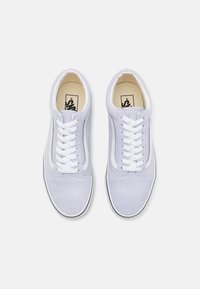 Light gray suede sneakers with white laces, leather accents, and a black rubber sole. Features classic design and branding on the insole.