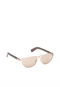 Lunettes de soleil aviateur élégantes avec monture dorée, verres marron clair et branches marron foncé, ornées d'un logo discret sur les branches et le pont.