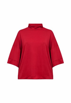 Punane puuvillane topp, millel on kõrge kaelus, lühikesed laiad varrukad ja lõdva istuvusega. Sile tekstuur, ilma mustrite või aktsendideta.