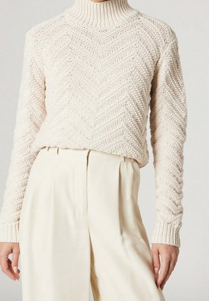 Stickad tröja - beige