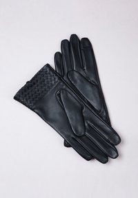 Black leather gloves with a woven texture at the wrist, flat fingers, smooth surface, and distinct stitching detail.
