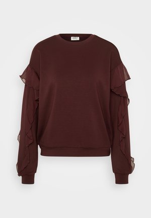 Sweat-shirt bordeaux à manches longues, avec des accents en volants transparents le long des manches, un col rond et des poignets et un ourlet côtelés.