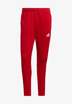 Pantalon de sport rouge fuselé avec une taille élastique et le logo Adidas blanc sur la partie supérieure de la cuisse droite.