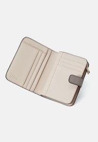 Beige leather wallet with a textured surface, features a brown clasp, multiple card slots, and a zippered compartment.