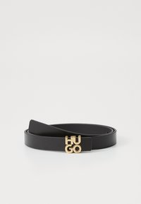 Curea din piele neagră cu o textură netedă și un design elegant, având o cataramă cu logo „HUGO” aurie. Lungime ajustabilă.
