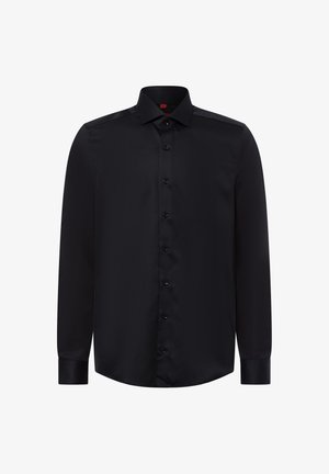 Schwarzes Langarmhemd aus glattem Stoff mit durchgehender Knopfleiste und klassischem Kragen. Mit schwarzen Knöpfen und abgerundetem Saum.