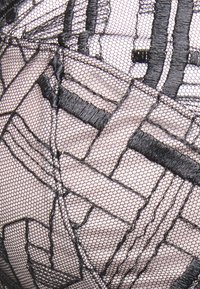 Black embroidered mesh fabric featuring geometric patterns and textures, creating a layered design with transparent and opaque sections.