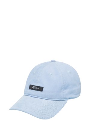 Light blue corduroy cap with a curved brim, featuring white eyelets and a black label with white text on the front.