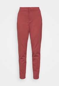 Pantalon de survêtement rouge en tissu doux, avec une coupe fuselée, une taille élastique, sans poches visibles ni ornements.