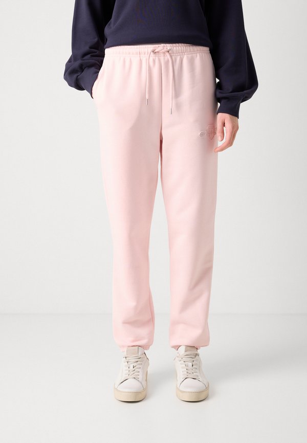 TONAL SHIELD - Tracksuit bottoms - salmon3