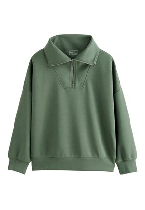 Sweat-shirt vert à col montant et demi-fermeture éclair devant. Confectionné en tissu lisse, il présente une coupe légèrement oversize et des poignets en bord-côte aux manches et à l'ourlet.