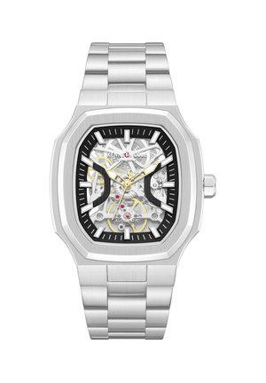 Sølvfarvet rustfrit stålautomatisk armbåndsur med rektangulært urskive, der viser synlige indre tandhjul og guldfarvede visere og timeindeks.