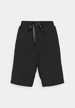 Shorts neri in cotone con vita elastica, caratterizzati da un laccio in raso e una vestibilità comoda. Texture liscia e senza motivi visibili.