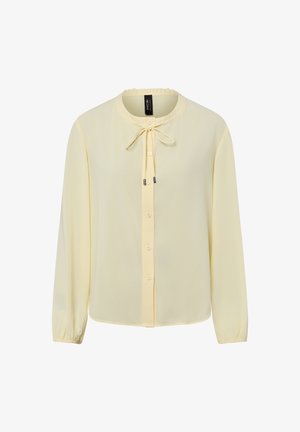 Yellow chiffon blouse with long sleeves, round neckline, button closure, and tie detail at the collar. Soft texture and lightweight design.