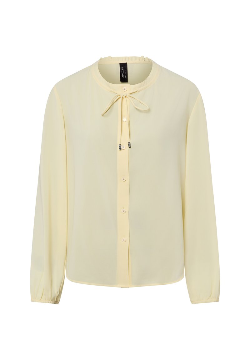 Żółta bluzka z szyfonu z długimi rękawami, okrągłym dekoltem, zapięciem na guziki oraz wiązaniem przy kołnierzu. Miękka tekstura i lekka konstrukcja.