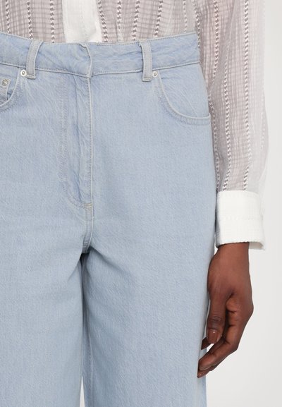 REMAIN COCOON PANTS - Široke nogavice - light blue