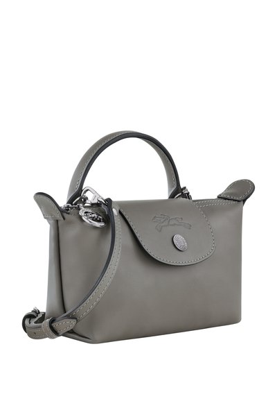 Gray leather handbag with a rounded shape, short handles, and a detachable shoulder strap. Features a flap closure and logo detail.