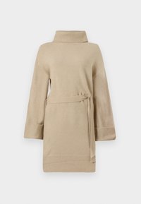 Beige pletená tunika s vysokým límcem a páskem v pase. Má široké rukávy a žebrované manžety, což dodává měkký a texturovaný vzhled.